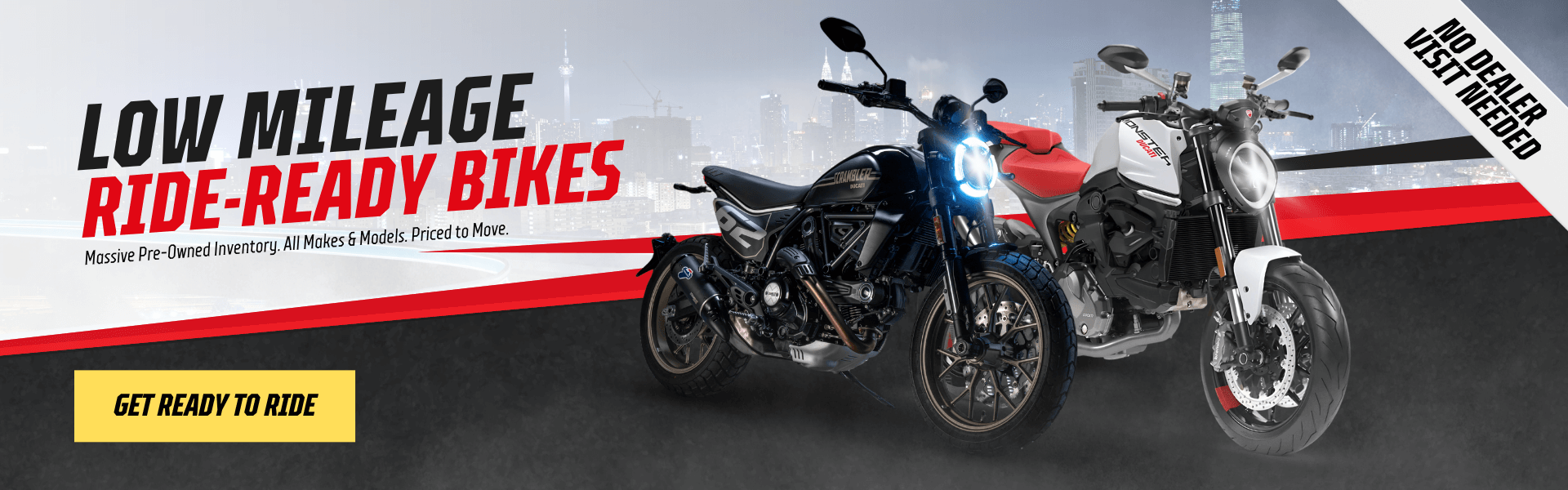 Ducati Scrambler and Monster parked in front of a city skyline with text “Low Mileage Ride-Ready Bikes”